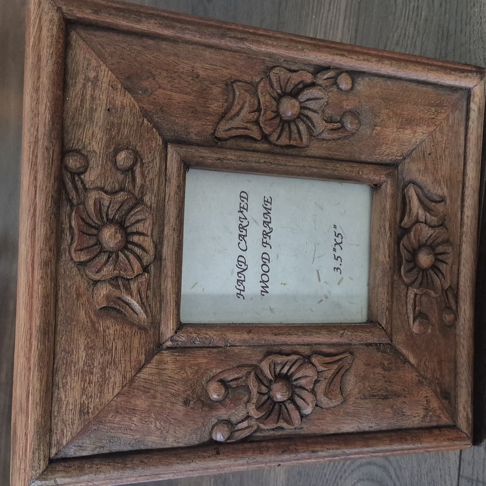 Quality hand carved wood frame, 9 x 10 1/2 inches with 3.5 x 5 inch opening.